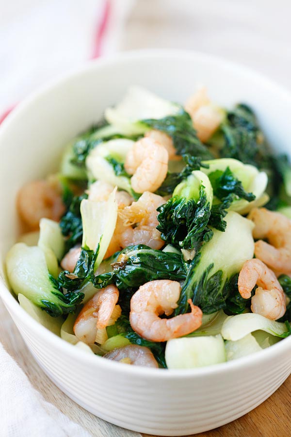 Healthy and delicious baby bok choy stir fried with shrimp in a bowl, ready to eat.
