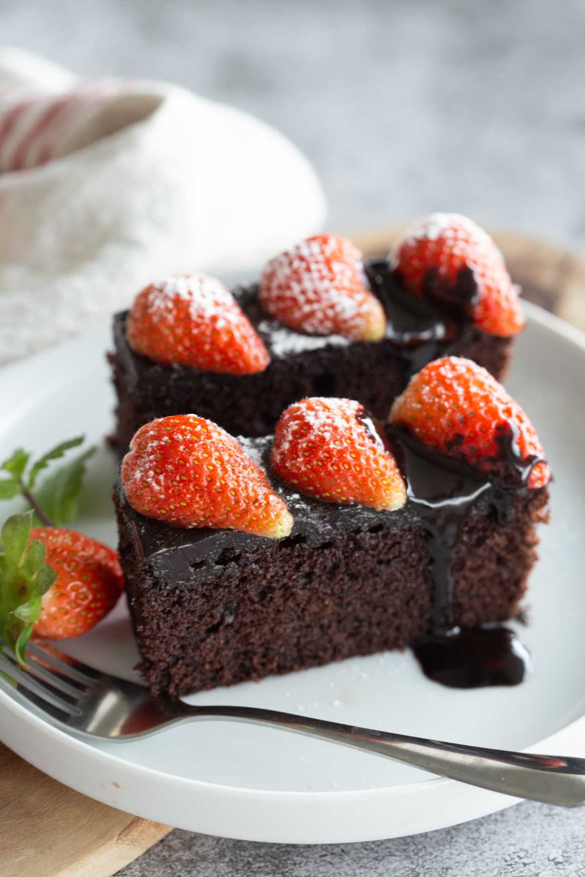 Chocolate cake with ganache and strawberries.