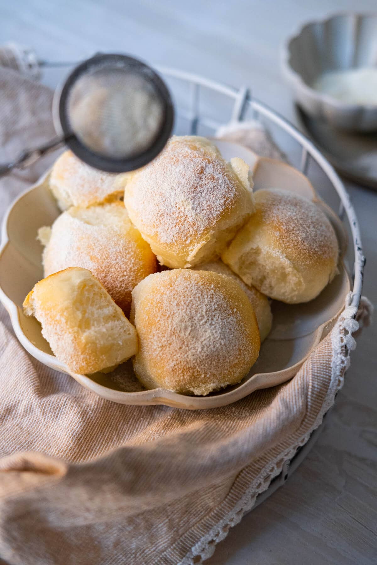 A captivating image showcasing the ingredients for bun, including milk, flour, and butter. The arrangement highlights the essential components for creating these delightful buns, inviting viewers to imagine the soft and fluffy texture and rich flavor that the ingredients promise in the final product.