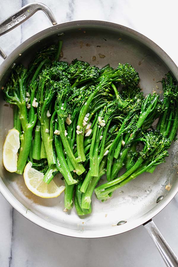 Sauteed broccolini in a pan.