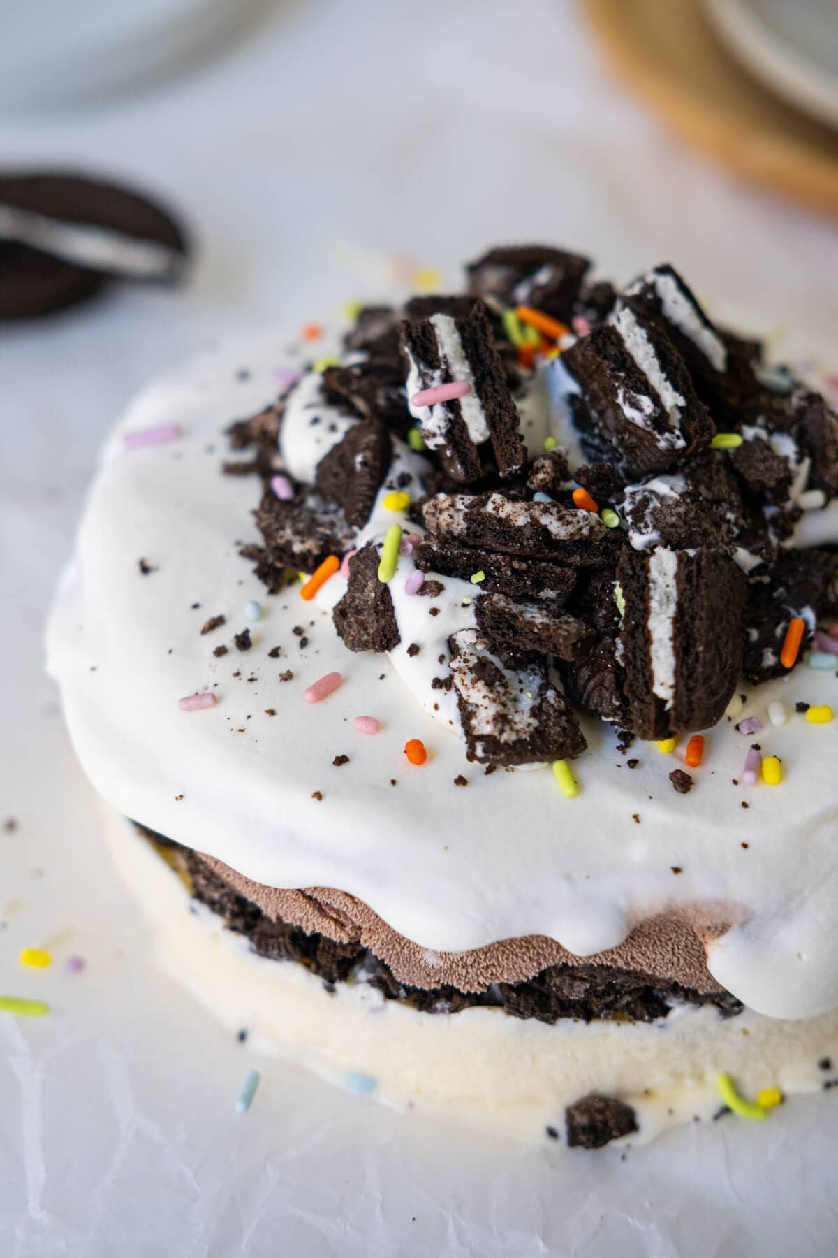 Cake made out of ice cream with Oreo crumbs and sprinkles on top.