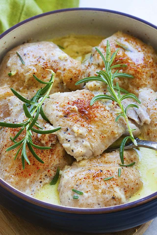 Instant pot creamy garlic chicken thighs topped with rosemary.