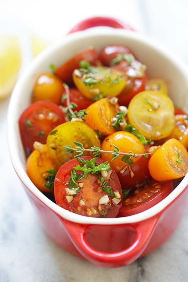 Easy and quick homemade marinated tomatoes salad with olive oil, balsamic vinegar and herbs.