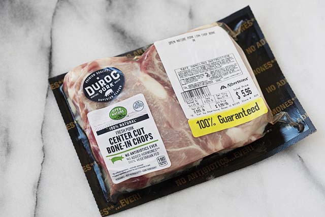 Raw bone in pork chops in a plastic bag for  pork chop recipes.