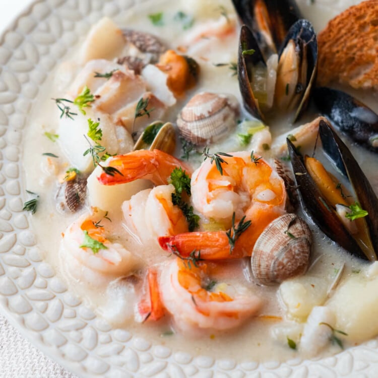 Seafood chowder overloaded with clams, mussels, prawns, and tender potatoes.