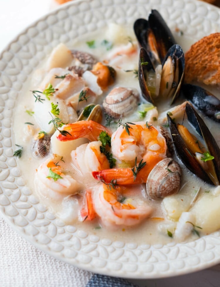 Seafood chowder overloaded with clams, mussels, prawns, and tender potatoes.